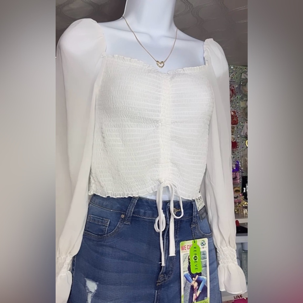 Cute stretchy top with long sleeve. The sleeves are see thru
